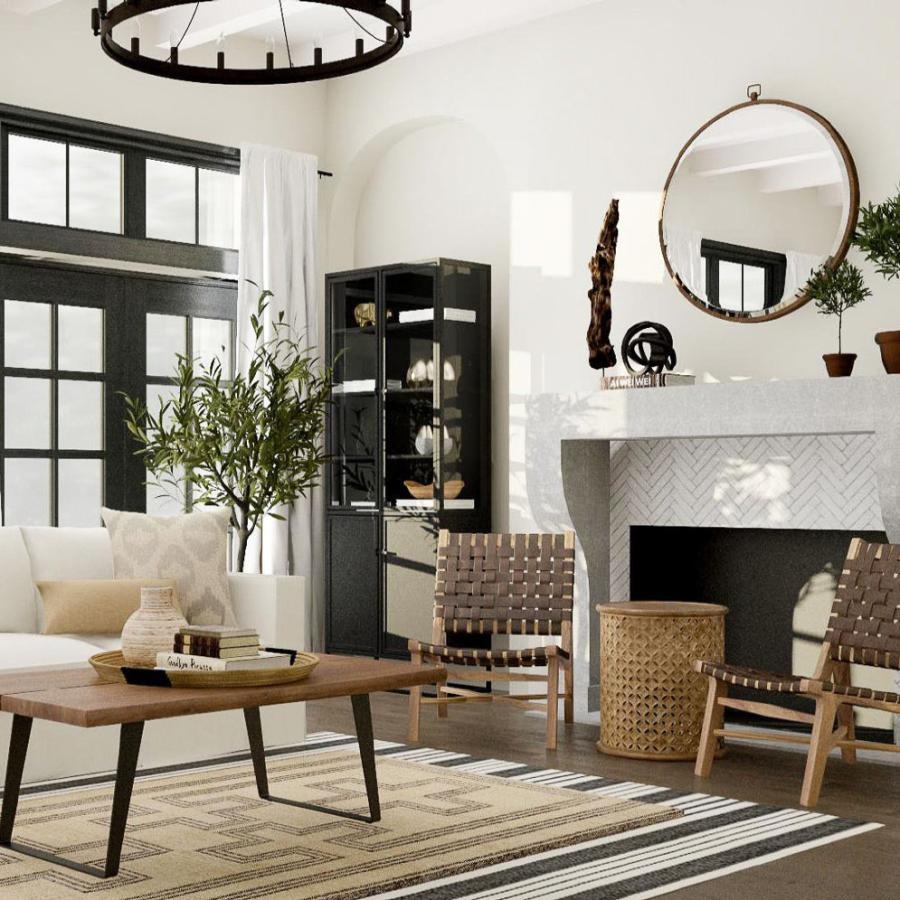 a living room with a fireplace, couch and chairs
